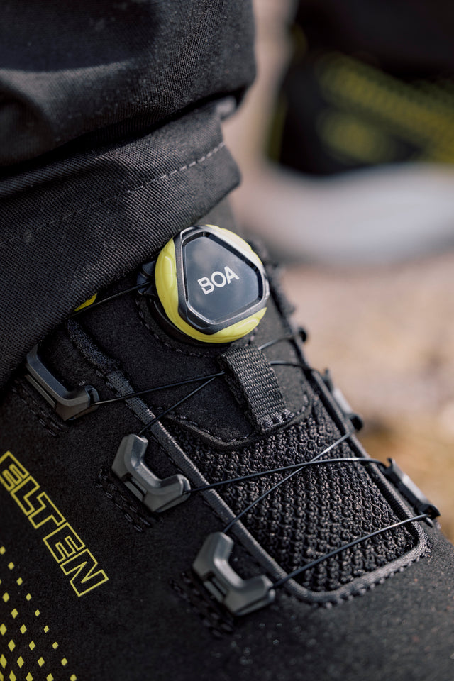 Person wearing a cool looking yellow safety shoe in a warehouse